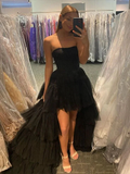 Woman in black strapless high-low tulle dress posing in boutique, ZAPDRESS fashion mirror selfie