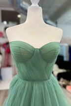 Strapless sage green tulle dress on mannequin, ZAPDRESS boutique display