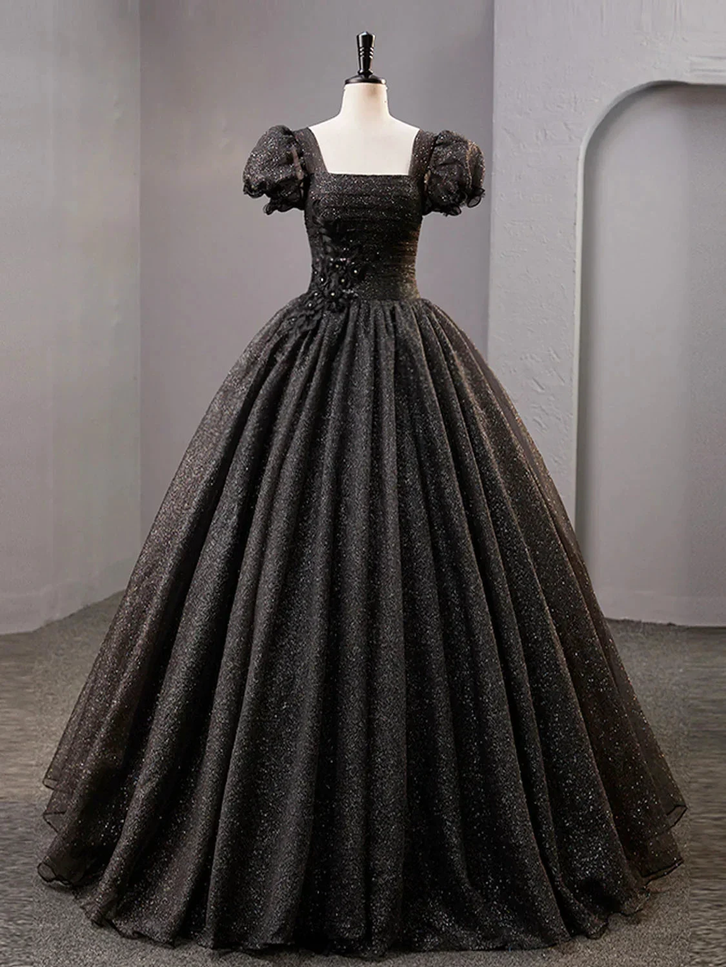 Elegant black glitter ball gown with puff sleeves on mannequin, ZAPDRESS fashion