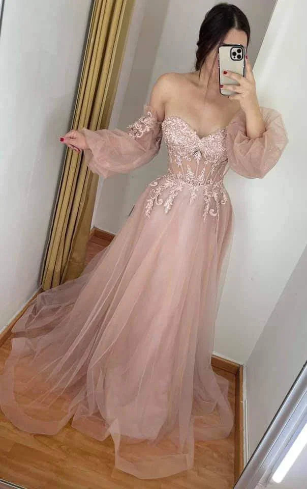 Woman in blush pink off-shoulder tulle evening gown with lace, ZAPDRESS fitting room