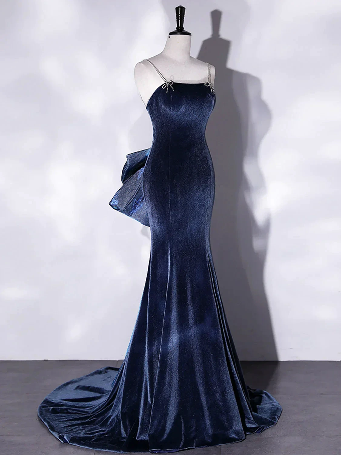 Elegant navy blue velvet evening gown with bow on display, ZAPDRESS fashion