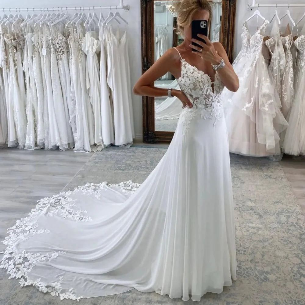 Beach Chiffon Wedding Dress Backless V-Neck Spaghetti Straps A-Line Bridal Gown with Lace Appliqués