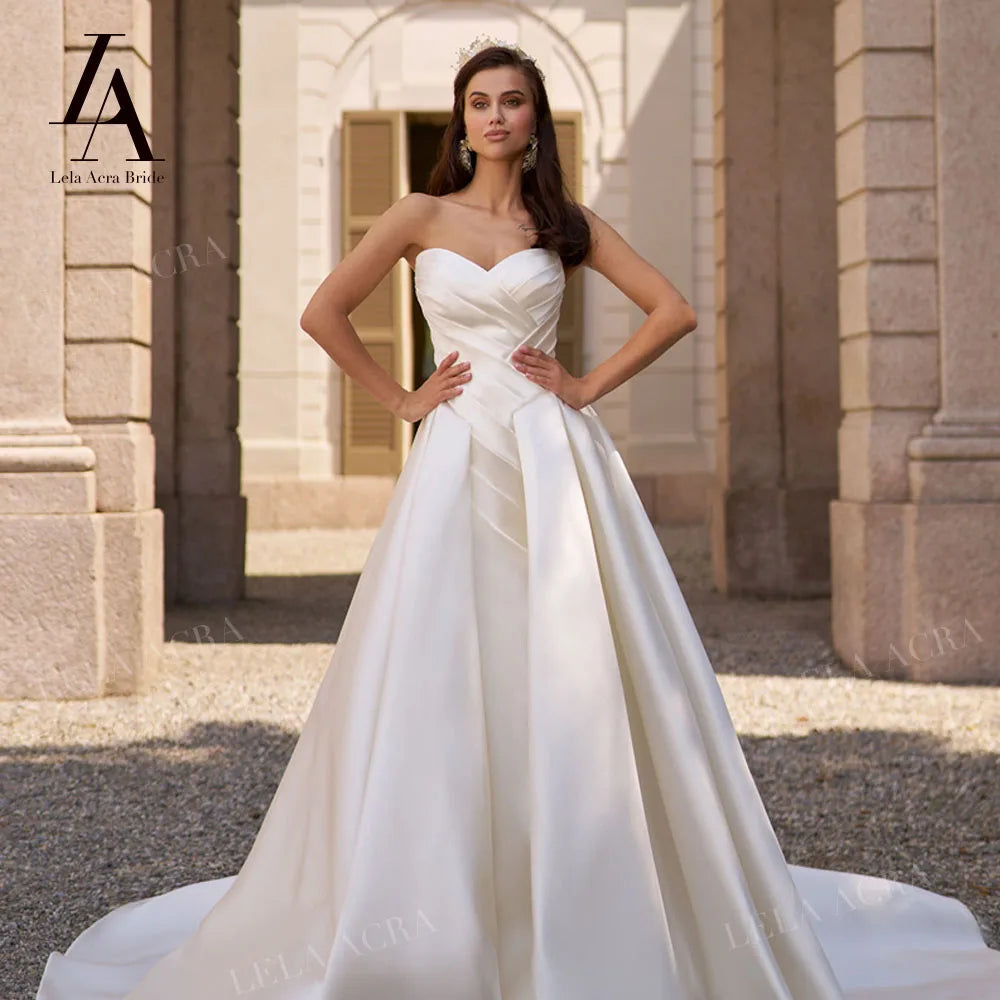 LelaAcra Sleeveless Satin A-Line Wedding Dress 2026 Sweetheart Backless Princess Bride Gown SM184 Plus Size Vestido De Noiva