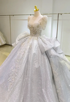 Silver Glimmer V-Neck Ballgown: Crystal-Embroidered Bust & Dramatic Bow Train by ZAPDRESS
