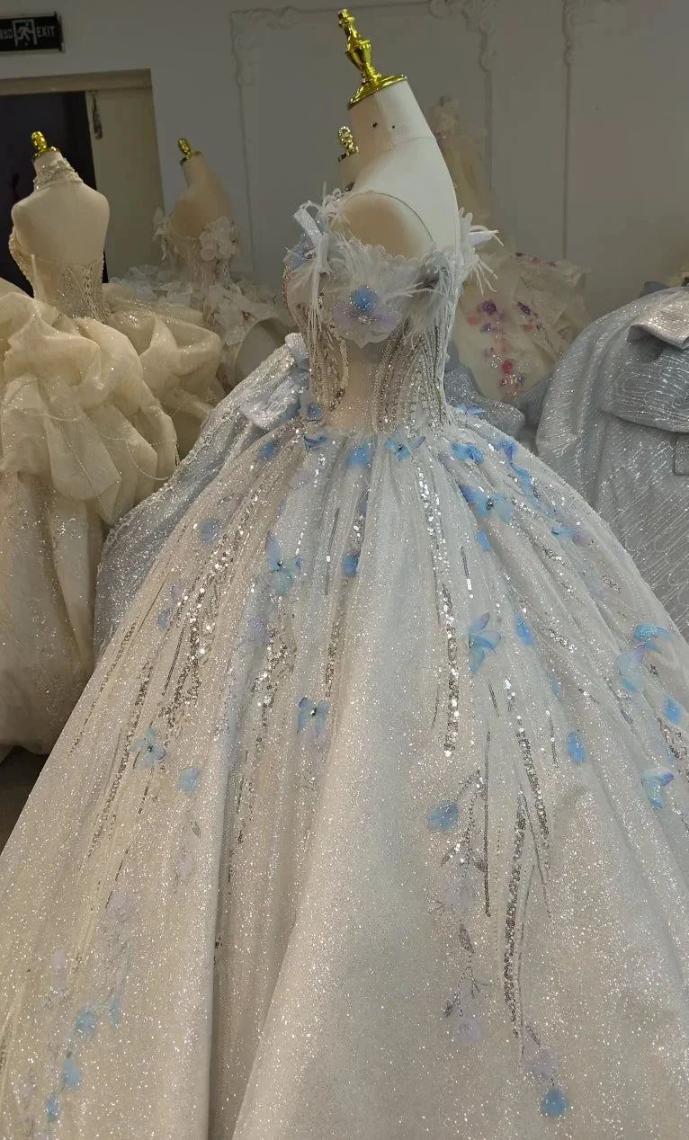 Ethereal Off-the-Shoulder Ball Gown Wedding Dress with Sequin Tulle, 3D Pastel Florals & Feather Accents Ye-2028 by ZAPDRESS