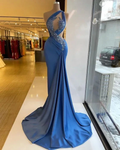 Elegant blue evening gown with lace accents on mannequin in ZAPDRESS boutique window display