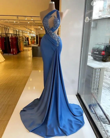 Elegant blue evening gown with lace accents on mannequin in ZAPDRESS boutique window display