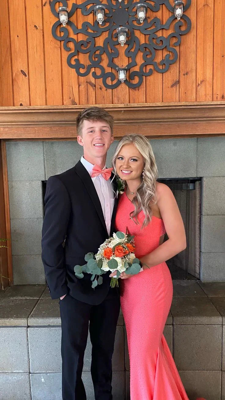 Young couple in formal attire, woman in coral prom dress holding bouquet, ZAPDRESS style