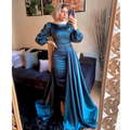 Woman in elegant teal satin gown with beaded waist from ZAPDRESS taking mirror selfie at home
