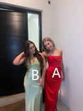 Two women wearing formal gowns, one in red and one in light green, standing indoors at ZAPDRESS