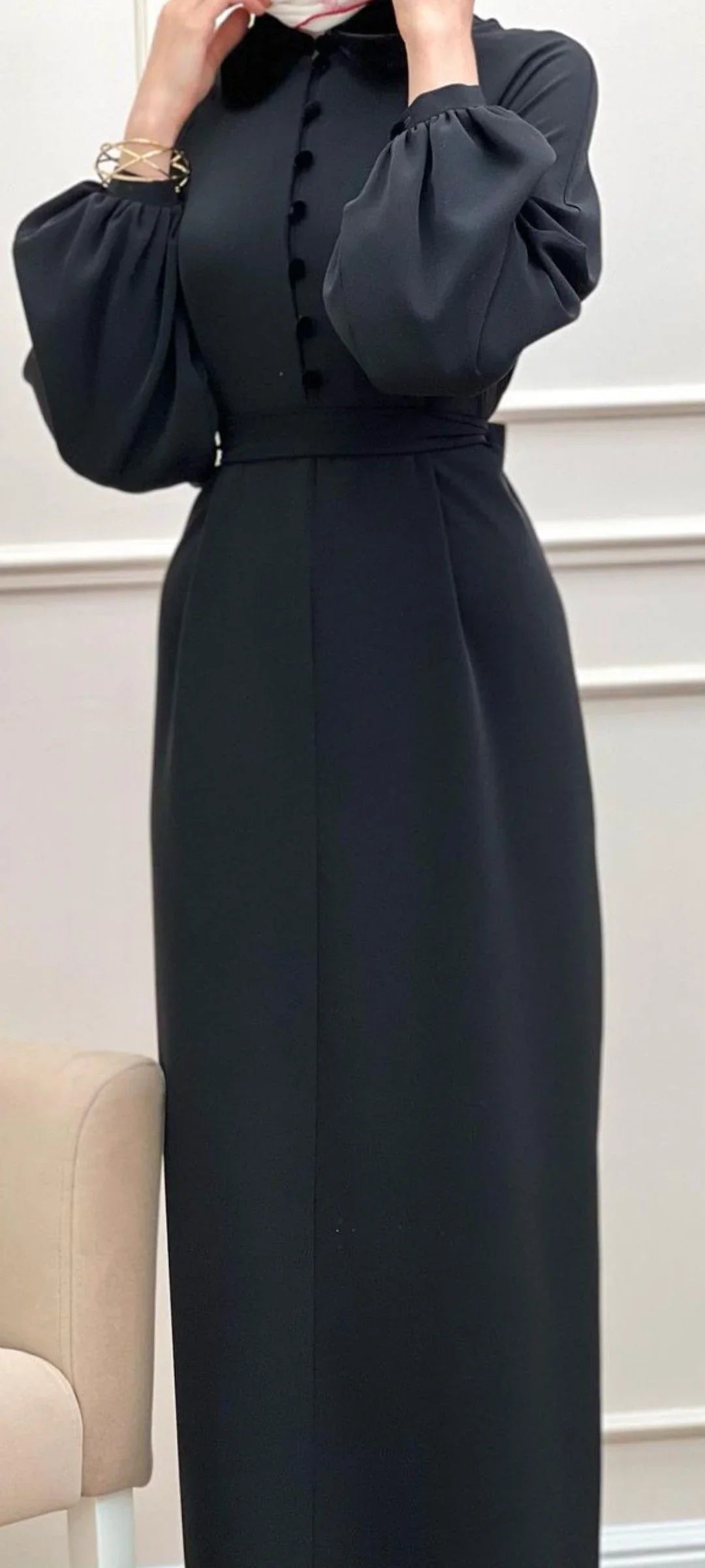 Elegant long black dress with puff sleeves and button detail, featured by ZAPDRESS