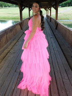 Woman in bright pink tiered tulle dress on covered wooden bridge, ZAPDRESS fashion