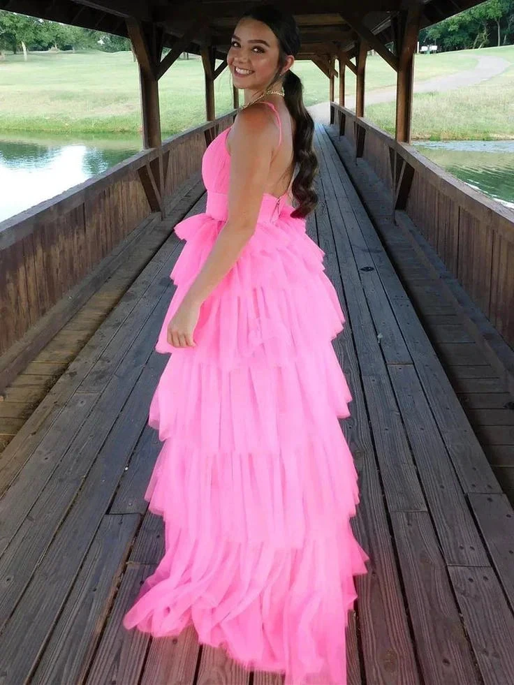 Woman in bright pink tiered tulle dress on covered wooden bridge, ZAPDRESS fashion