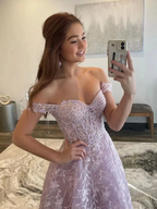 Smiling woman in off-shoulder lavender lace prom dress taking mirror selfie, ZAPDRESS