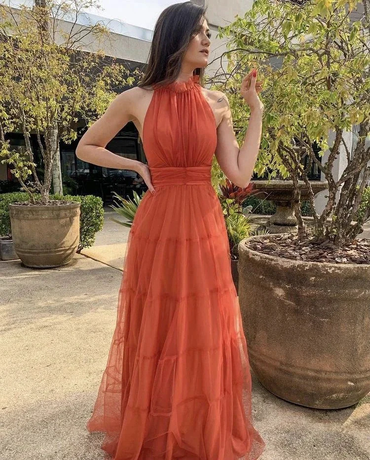 Woman in a sleeveless orange maxi dress outdoors, ZAPDRESS fashion style
