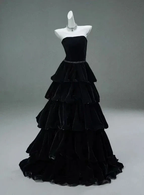 Elegant black tiered velvet evening gown on mannequin, ZAPDRESS fashion