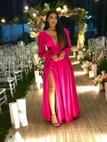 Woman in a vibrant pink evening gown at an elegant outdoor event, ZAPDRESS fashion