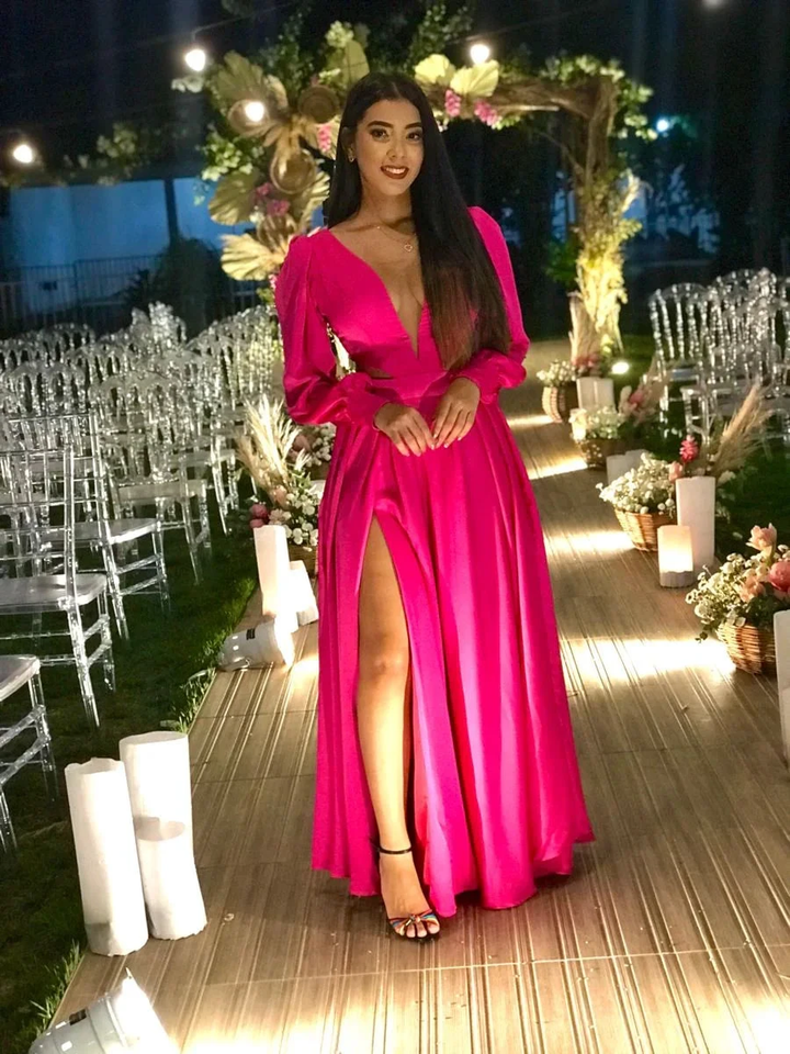 Woman in a vibrant pink evening gown at an elegant outdoor event, ZAPDRESS fashion