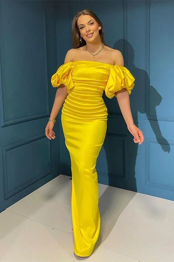 Woman in a bright yellow off-shoulder evening dress from ZAPDRESS, posing indoors