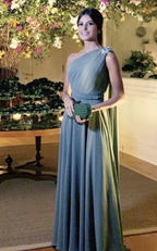 Woman in elegant one-shoulder blue gown holding green clutch, ZAPDRESS evening dress style