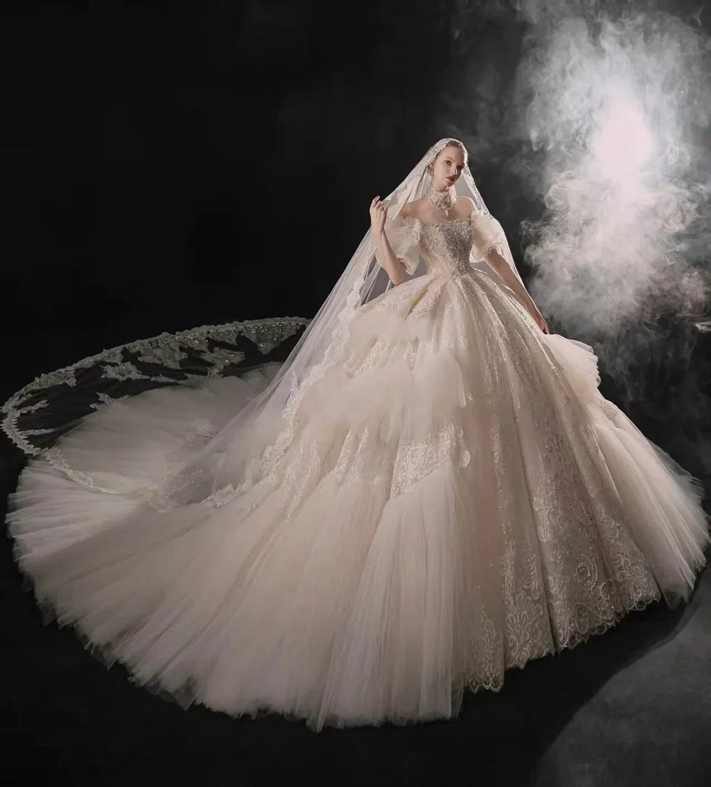 Opulent Off-the-Shoulder Ball Gown Tulle Puff Sleeve Beaded Lace Wedding Dress with Layered Ruffled Train & Choker Q6001 by ZAPDRESS