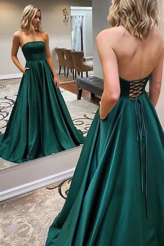 Vestido de fiesta elegante, largo, de satén, sin tirantes, con espalda descubierta y bolsillos.