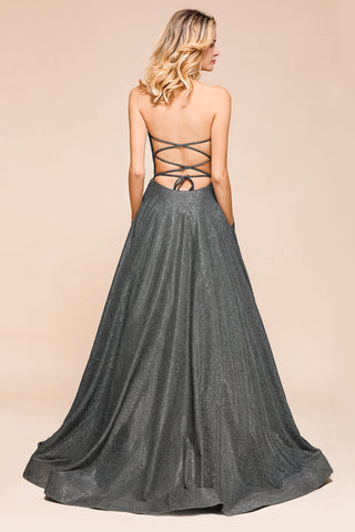 Vestido de fiesta largo con abertura y espalda descubierta sin tirantes y con purpurina