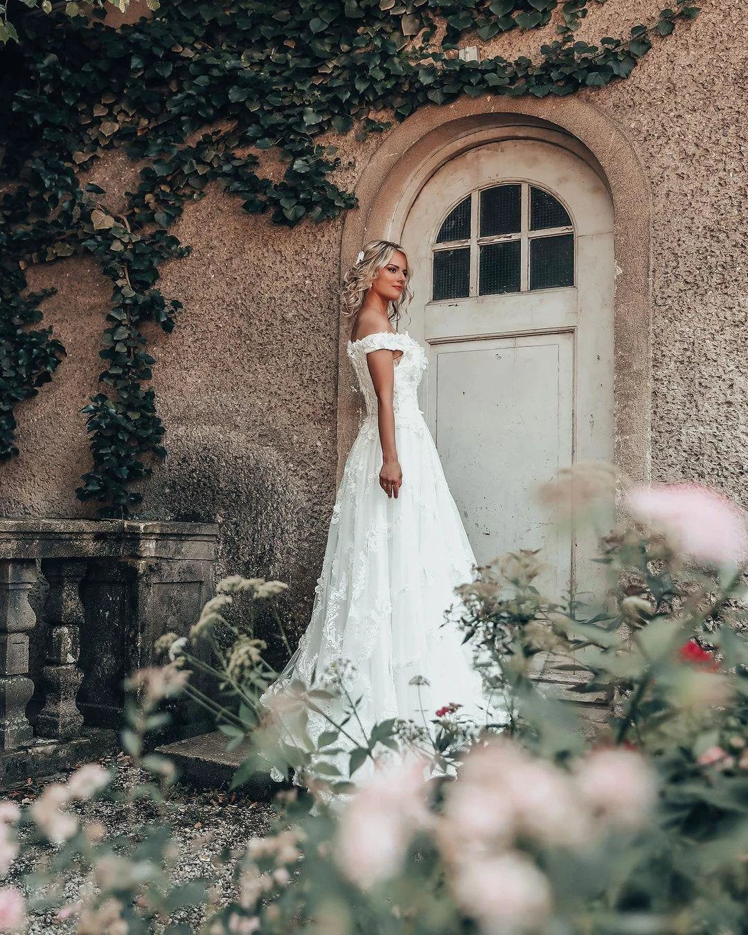Long A-line Off-the-shoulder 3D Flroal Wedding Dress with Lace Appliques by BIZTUNNEL