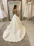 Long A-Line V-neck Spaghetti Straps Backless Wedding Dress With Pockets by BIZTUNNEL