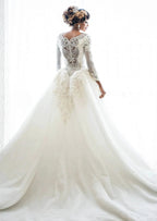 Vestido de novia de manga larga con apliques de encaje y cuentas de sirena con sobrefalda
