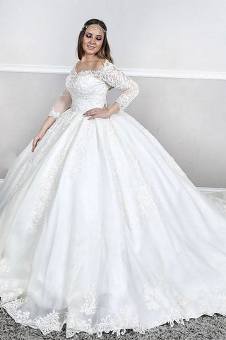 Vestido de novia princesa con escote cuadrado, mangas largas y encaje abullonado