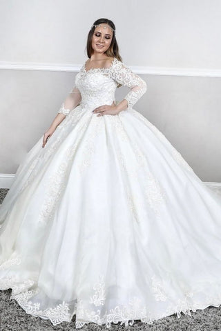 Vestido de novia princesa con escote cuadrado, mangas largas y encaje abullonado