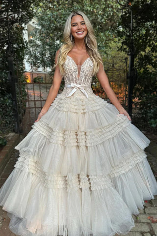 Vestido de fiesta largo rosa de tul con volantes y hombros descubiertos con lazo